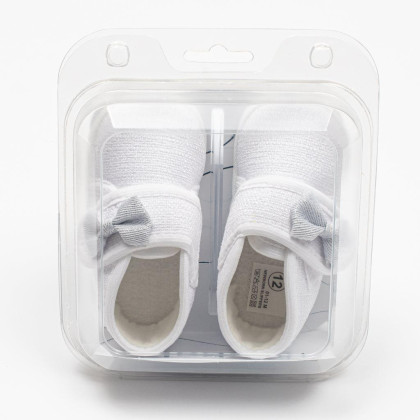 Kojenecké capáčky s mašličkou New Baby bílá