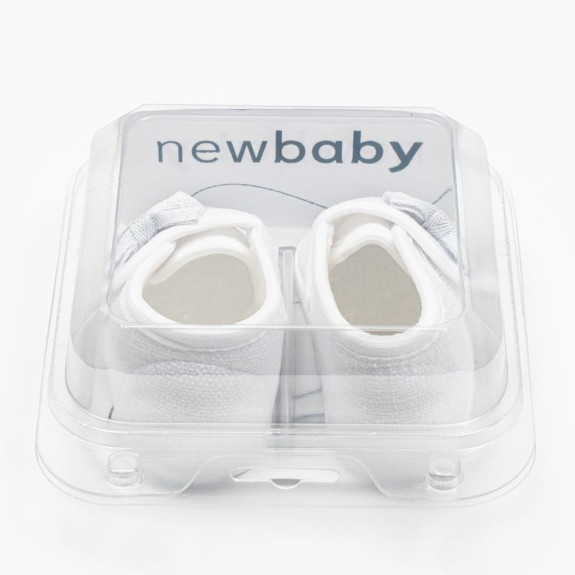 Kojenecké capáčky s mašličkou New Baby bílá
