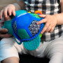 Hračka aktivní na C kroužku želva Neptune’s Sensory Sidekick™ 0 m+